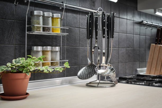 Kitchen utensils on work top in modern kitchen closeup
